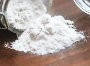 Phenibut HCL Powder spilling out of a jar