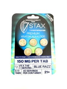 Front of 7 STAX Kratom Alkaloids packaging with blue-green gradient, text'Premium Kratom Alkaloids' and '150 mg per tab' visible.